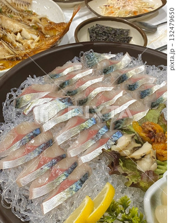 Fresh and delicate sashimi slices, beautifully presented with vibrant colors and perfect cuts. This traditional Japanese delicacy highlights the pure flavors of premium seafood. Fresh and delicate sashimi slices, beautifully presented with vibrant colors and perfect cuts. This traditional Japanese delicacy highlights the pure flavors of premium seafood. 132479650