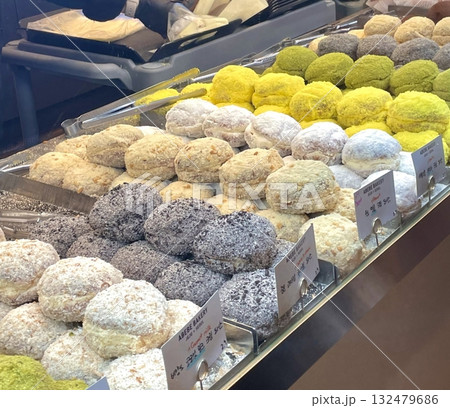 Beautiful and delicious pastries displayed in a bakery, with colorful glazes, delicate toppings, and tempting textures—offering a perfect visual feast of sweetness and artisanal charm. 132479686