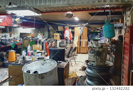 A mess in the workshop, an unorganized garage. A mess in the workshop, an unorganized garage. 132482282