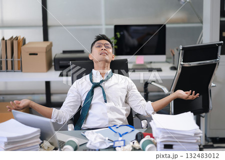 stressed Asian businessman working in the office. Businessman thinking too much work concept in the office. 132483012