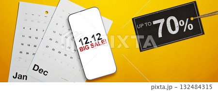 12.12 big sale text on cellphone screen with up to 70% text on the label tag. Copy space. Flash sale concept 132484315