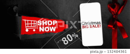 Christmas big sale text on cellphone screen with red ribbon and up to 80% text on the label tag. Copy space. Christmas sale concept Christmas big sale text on cellphone screen with red ribbon and up to 80% text on the label tag. Copy space. Christmas sale concept 132484361