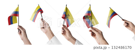 The Ecuador flag in hand in different angles on a white background 132486170