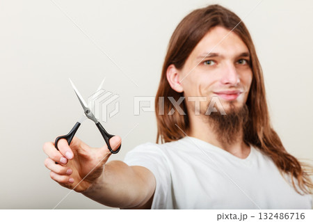 Hairstylist with scissors in hand Hairstylist with scissors in hand 132486716