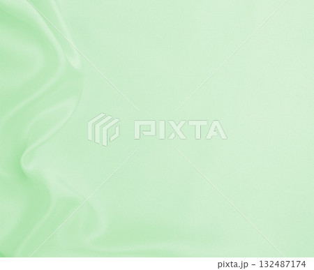 Smooth elegant green silk or satin luxury cloth texture as abstract background. Luxurious background design Smooth elegant green silk or satin luxury cloth texture as abstract background. Luxurious background design 132487174