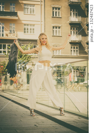 Fashionable woman in city 132487423