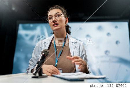 woman is giving a presentation at a conference 132487462