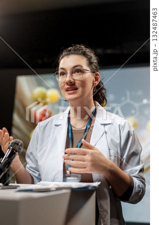 woman is giving a presentation at a conference woman is giving a presentation at a conference 132487463