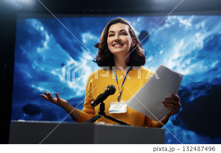 woman is giving a presentation at conference 132487496