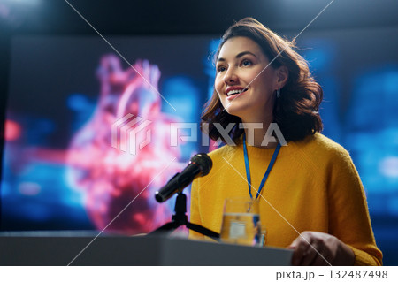 woman is giving a presentation at conference 132487498