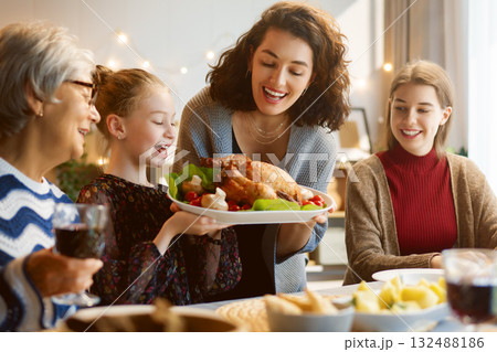 Family celebrating Thanksgiving Day Family celebrating Thanksgiving Day 132488186