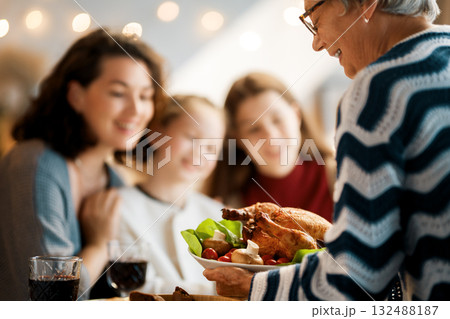 Family celebrating Thanksgiving Day Family celebrating Thanksgiving Day 132488187