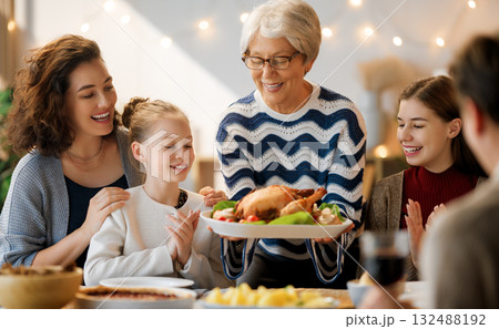 Family celebrating Thanksgiving Day 132488192
