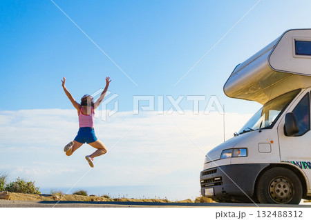 Woman enjoy trip with motorhome 132488312