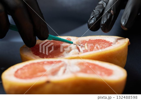 Food testing in the laboratory. The lab technician prepares a sample for microscopic examination. Food testing in the laboratory. The lab technician prepares a sample for microscopic examination. 132488598