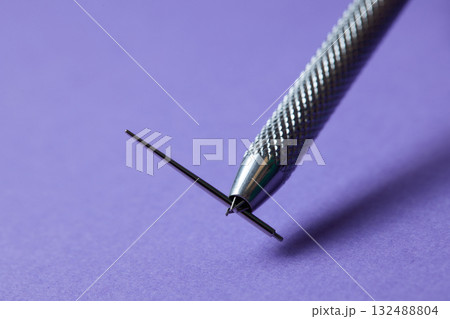 Piercing earrings close-up. On a Violet background. 132488804