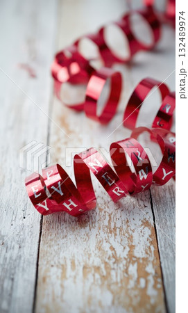 Red ribbon spirals with craft letters Red ribbon spirals with craft letters 132489974