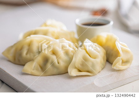 Traditional japanese gyoza dumplings on white table. 132490442