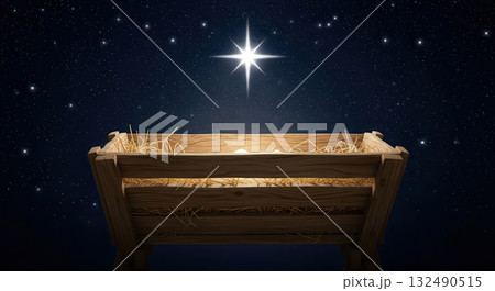 Wooden manger filled with straw, illuminated by bright starry night sky, symbolizing Christmas and New Year celebrations, evoking warmth and festive spirit 132490515