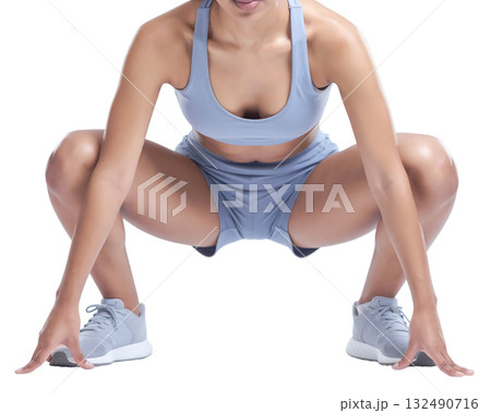 Girl squatting before starting sports exercise close-up 132490716