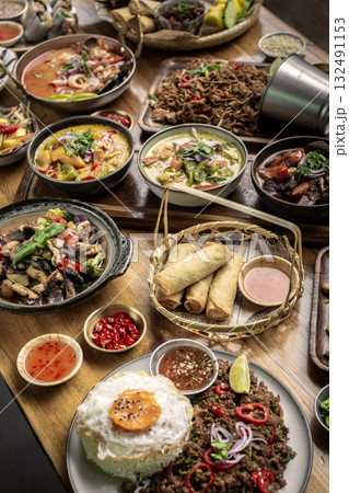 many different thai food dishes on table in modern restaurant in bangkok thailand many different thai food dishes on table in modern restaurant in bangkok thailand 132491153