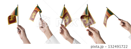 The Sri Lanka flag in hand in different angles on a white background The Sri Lanka flag in hand in different angles on a white background 132491722