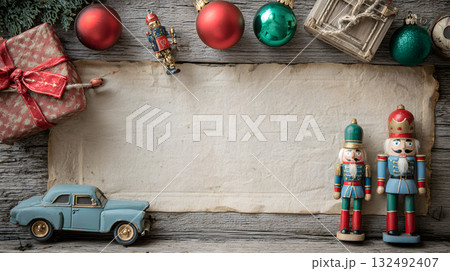 Holiday decorations with nutcracker figures, vintage car, and wrapped gift on rustic wooden table Holiday decorations with nutcracker figures, vintage car, and wrapped gift on rustic wooden table 132492407