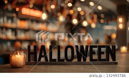 A Halloween-themed setting with a wooden sign spelling 'HALLOWEEN' in focus. Soft candlelight illuminates the scene, creating a festive atmosphere. A Halloween-themed setting with a wooden sign spelling 'HALLOWEEN' in focus. Soft candlelight illuminates the scene, creating a festive atmosphere. 132493786