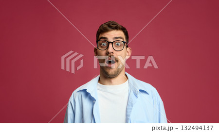 Shocked man with open mouth and wide eyes expressing disbelief and surprise 132494137
