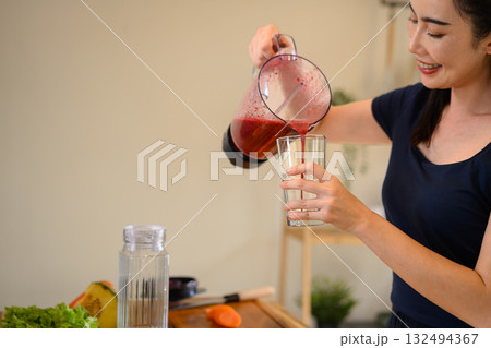 Photo set of a woman making a fruit smoothie in her home kitchen, reflecting a healthy and balanced daily lifestyle Photo set of a woman making a fruit smoothie in her home kitchen, reflecting a healthy and balanced daily lifestyle 132494367