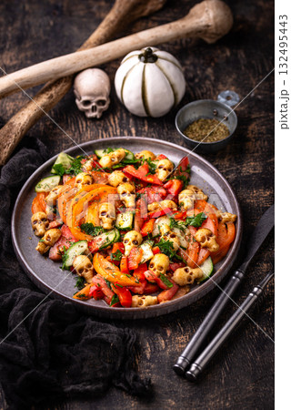 Halloween salad with cheese in shape of skull 132495443