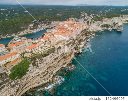 Aerial view marina cape Bonifacio south Corsica France citadel on rocky promontory on wild white limestone cliffs 132496095