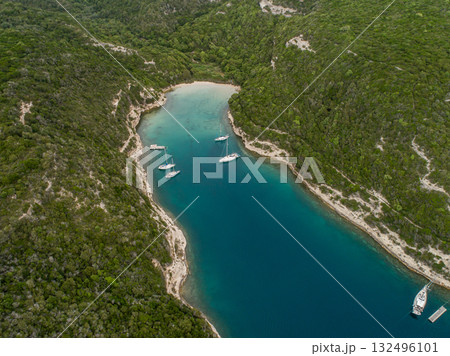 Aerial view marina cape Bonifacio south Corsica France citadel on rocky promontory on wild white limestone cliffs 132496101
