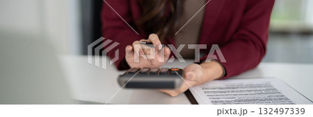Real estate sales agent calculates property finance mortgage investment planning for home sales client transaction business success Real estate sales agent calculates property finance mortgage investment planning for home sales client transaction business success 132497339