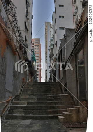 18 Oct 2025 Hidden alley with neon lights and urban textures 132498572