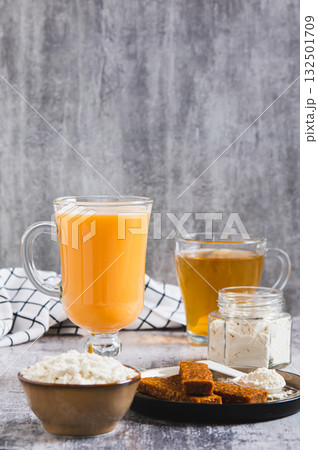 Protein shakes, protein powder, green tea and protein bars for clean eating vertical view 132501709