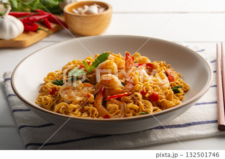 Stir fried instant noodles and shrimp with basil leaves.Thai food.(pad ka prao) Stir fried instant noodles and shrimp with basil leaves.Thai food.(pad ka prao) 132501746