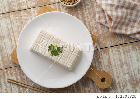 Fresh White Tofu soy bean curd on white plate.Top view 132501829