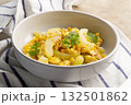 Stir Fried Winter Melon with Egg in white bowl. 132501862