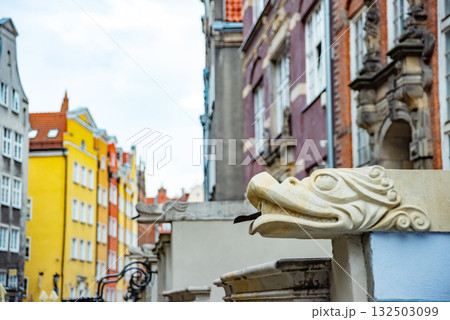 Captivating view of intricate wrought iron railings set against the historic red brick buildings in Gdansk Old Town. The architectural detail reflects the city's rich history 132503099