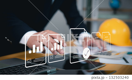 Digital document management businessman using laptop with virtual data files and workflow automation system Digital document management businessman using laptop with virtual data files and workflow automation system 132503240