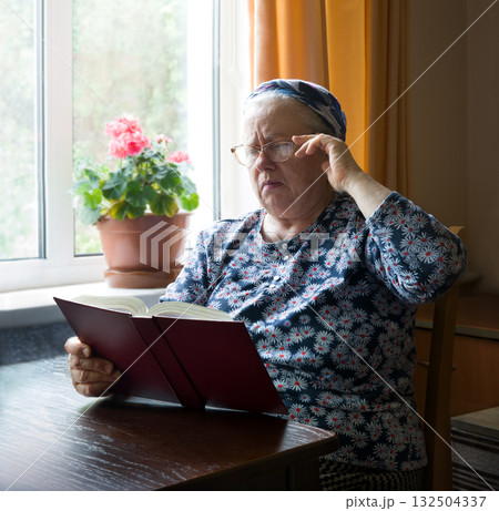 Old woman with big bpook 132504337