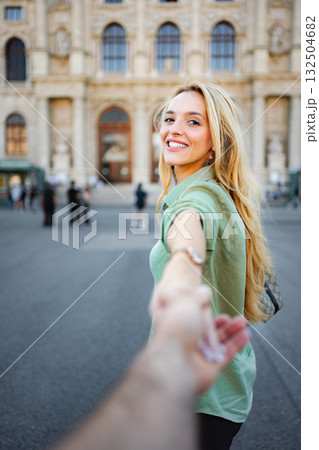 Woman leading partner while traveling in Vienna Austria Woman leading partner while traveling in Vienna Austria 132504682