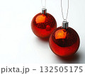 Two shiny red christmas ornaments with glitter detail 132505175