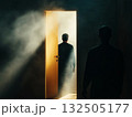 Man walking into glowing doorway 132505177