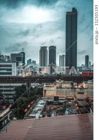 contrast of modern buildings and decay in futuristic cyberpunk metropolis city with skyscrapers, gloomy high-tech cityscape with rundown dystopian ruins 132505193
