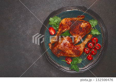 grilled fried chicken legs, served with fresh cherry tomatoes and herbs, on a plate, homemade, no people, grilled fried chicken legs, served with fresh cherry tomatoes and herbs, on a plate, homemade, no people, 132506476