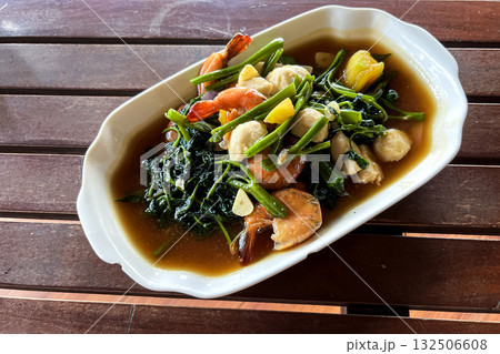 Adobong Kangkong Filipino hot salad with spinach, vegetables, and shrimp Adobong Kangkong Filipino hot salad with spinach, vegetables, and shrimp 132506608