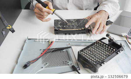 Closeup hand of computer hardware technician dissemble and fixing computer PC. Closeup hand of computer hardware technician dissemble and fixing computer PC. 132506679