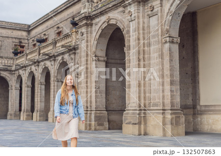 Young woman tourist standing near Chapultepec Castle in Mexico City, exploring the historic landmark. Solo travel, cultural heritage, tourism, and adventure concept 132507863